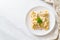 tortellini pasta with mushroom cream sauce and cheese