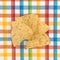 Tortilla chips on a colorful place mat