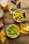 Tortilla chips with dips, guacamole and salsa