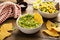 Tortilla chips with dips, guacamole and salsa