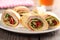 Tortilla roll-ups with ham and vegetables