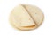 Tortilla on a white isolated background. Corn tortilla or simply tortilla is a type of thin unleavened bread made from Hominy