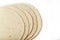 Tortilla on a white isolated background. Corn tortilla or simply tortilla is a type of thin unleavened bread made from Hominy