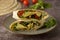 Tortilla wraps with avocado, cherry tomato. Healthy, vegan food. Take away snack