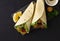 Tortillas wrapped with falafel balls and fresh vegetables, vegetarian healthy food, on a black background, no people,