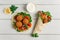 Tortillas, wrapped falafel balls, with fresh vegetables, vegetarian healthy food, on a wooden white background, no