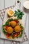 Tortillas, wrapped falafel balls, with fresh vegetables, vegetarian healthy food, on a wooden white background, no