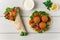 Tortillas, wrapped falafel balls, with fresh vegetables, vegetarian healthy food, on a wooden white background, no