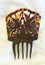 Tortoise shell hair comb on ivory white background