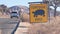 Tortoise or turtle crossing yellow road sign, California USA. Wild animal xing.