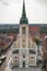 ToruÅ„, Poland - August 19, 2022: View from tower on church of Holy Spirit and old or modern buildings in center of city Toru