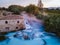 Toscane Italy, natural spa with waterfalls and hot springs at Saturnia thermal baths, Grosseto, Tuscany, Italy aerial