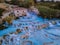 Toscane Italy, natural spa with waterfalls and hot springs at Saturnia thermal baths, Grosseto, Tuscany, Italy aerial