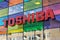 Toshiba shop sign on colored reflecting windows