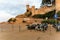 Tossa de Mar, Catalonia, Spain, August 2018. View of the fortress and parking of motorcycles at sunset.