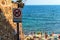 Tossa de Mar, Spain, August 2018. Prohibitory sign with a dog on the background of the sea and beach.