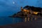 Tossa de Mar, Spain - The illuminated castle towers over the beach, creating a magical atmosphere at night