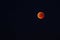 Total moon eclipse with blood moon in close up