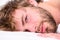 Total relax concept. Man unshaven bearded face sleep relax or just wake up. Guy bearded macho relax in morning. Man