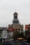 Total view on a historical church with steeple rising in the cloudy sky in leiden south holland netherlands