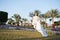 Totally happy. Bride luxury white wedding dress sunny day tropic nature background. Tropic wedding. Woman happy pretty
