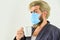 Totally protected. Wearing mask protect from coronavirus. Guy in mask drink tea coffee using straw. Serious about