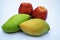 Totapuri mango or Bangalora mango with Fresh red apples nutritious, in white background, falhar fasting from India, fruits of