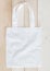 Tote bag mock up canvas fabric cloth shopping sack on white wood