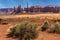 Totem Pole Spire and Yei Bi Chei Spires with mesa backdrop in Monument Valley tribal park