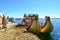 A Totora boat floating on the Titicaca lake, in Peru