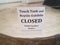 Touch tank closed sign with glass and sand