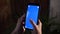 Touching, zooming, tapping and sliding on blue chroma key smartphone screen.