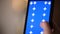 Touching, zooming, tapping and sliding on blue chroma key smartphone screen.