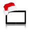 Touchpad pc and Santa Claus red christmas hat