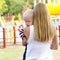 Touchy little boy in the arms of his mother