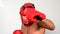 Tough boxer punching with red gloves