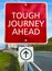 Tough journey Ahead road sign.