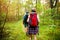 Tough route. Beautiful young couple hiking together in the woods while enjoying their journey.