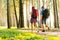 Tough route. Beautiful young couple hiking together in the woods while enjoying their journey.