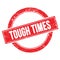 TOUGH TIMES text on red grungy round stamp