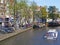 Tour boat navigates scenic Amsterdam canal