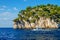 A tour boat sails along the rocks of the National Parc des Calanques.