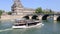 Tour boat on the Seine river in Paris, France