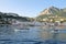 Tour boats towing blue grotto boatmen, Marina Grande, Capri, Italy