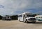 Tour buses and vans parked near the Exuma International Airport located near Moss Town, George