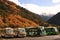 Tour busses fill the welcoming area of Jiuzhaigou Valley National Park of Sichuan, China.