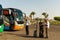 tour busses with guides waiting for tourists