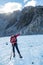 Tour guide points at fox glacier peak, New Zealand