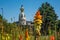 Tour Lu in Nantes on a Sunny Summer Day with Green Vegetation and Orange Common Torch Lilly Flowers