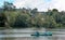 Tour people boating at kodaikanal lake near boat house.